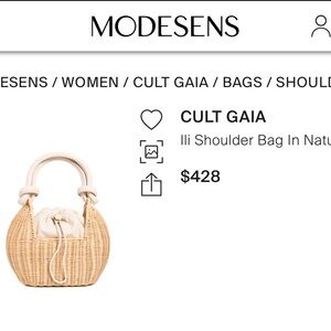 Cult Gaia lli straw bag with leather handle.